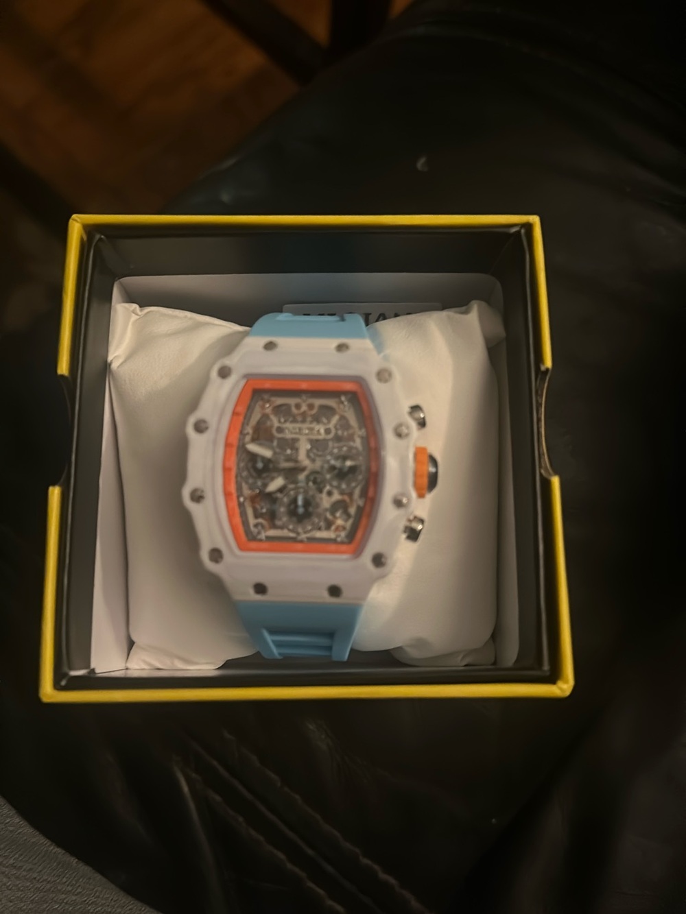 Sporty White & Light Blue Watch with Orange Accent